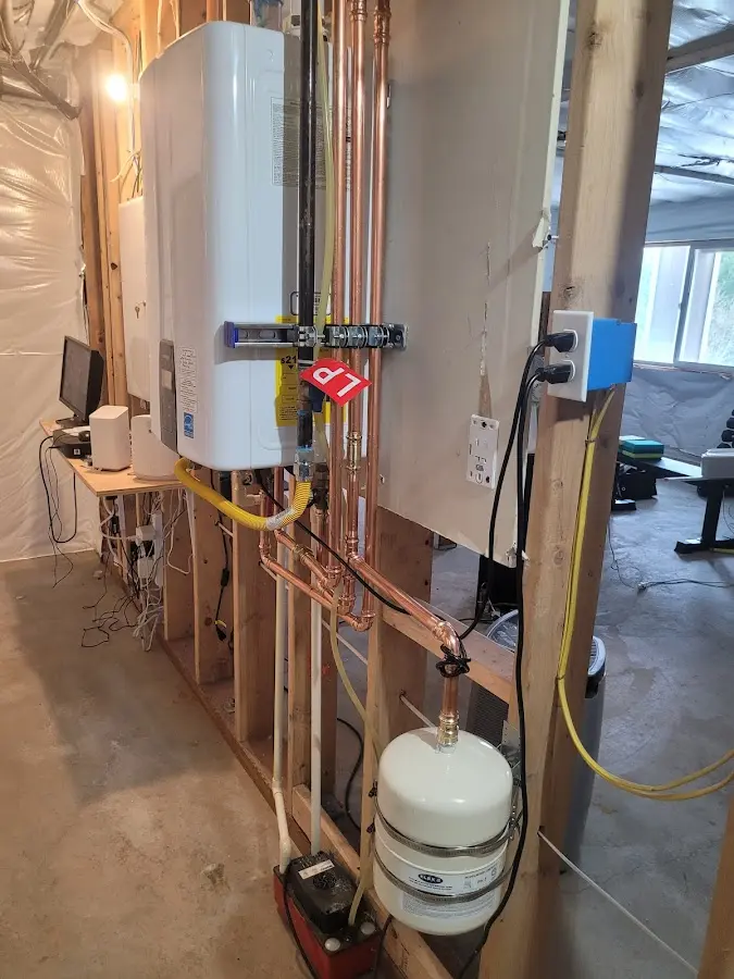 Licensed plumber repairing a kitchen sink in Upton